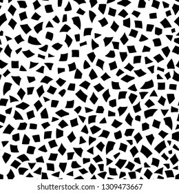 Abstract seamless pattern of small pieces of paper or splinters of ceramics of different sizes in black and white colors