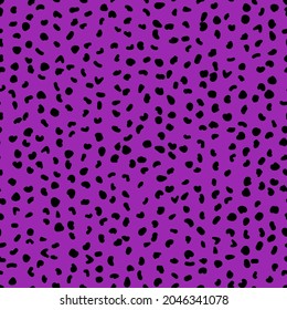 Abstract seamless pattern from small shapes. Simple background of irregular spots. Abstract wild animal skin print. Random spaced black spots. Vector illustration on purple background