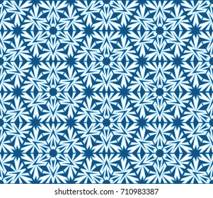 Abstract seamless pattern with snowflakes and elements of kaleidoscope
