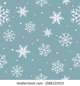 Abstract Seamless pattern with snowflakes and snow on lightblue background. Holiday New Year and Merry Christmas. Ideal for fabric,  decor, print, textile, wrapping, wallpapers, web background, cover