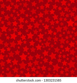 Abstract seamless pattern of stars of different sizes in red colors