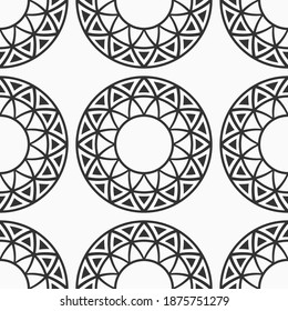 Abstract seamless pattern with symmetric circle shapes, made of triangles. Repeating geometric ethnic ornament. Modern stylish texture. Vector monochrome background.