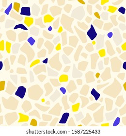 Abstract seamless pattern in terrazzo style. Vector background. Colorful print for wallpaper, backdrop, fabric, etc. Beige, blue and yellow colors