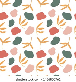 Abstract seamless pattern. Trendy wallpaper with random different shapes and floral elements. Ochre, terracotta, gold, yellow, pink, dark dusty green. Modern textile, branding and packaging.
