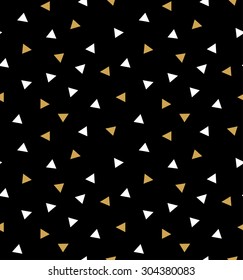 Abstract seamless pattern with triangles in gold and white on the dark gray background.