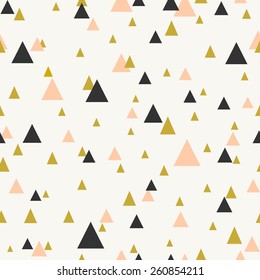 Abstract seamless pattern with triangles in pastel pink, gold and dark gray.