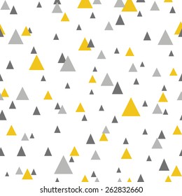 Abstract seamless pattern with triangles in yellow and gray.