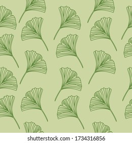 Abstract seamless pattern with tropical leaves on light green background. Hand draw texture. Vector template for fashion print. 