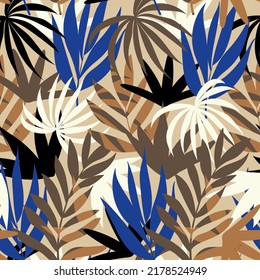 Abstract seamless pattern with tropical plants and leaves. Colorful background with exotic leaves. Floral design for fabric, paper, cover, interior decor and other users.