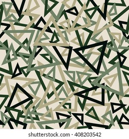 Abstract seamless pattern of turquoise and green overlapping triangles chaotic scattered on a light beige background.