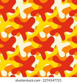 Abstract seamless pattern with various elements in the form of paint blots. Chaotic vector texture with ink shapes. Printing on textiles and paper. Background masking red and orange