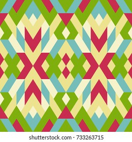 Abstract seamless pattern. Vector geometric background of triangles in white, red, yellow and green colors. Mosaic texture 