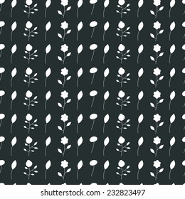 Abstract seamless pattern of white flowers and leaves on a black background