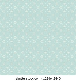 Abstract seamless pattern with white snowflakes on pale turquoise background