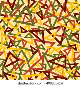 Abstract seamless pattern of yellow, maroon and green overlapping triangles chaotic scattered on a light yellow background.