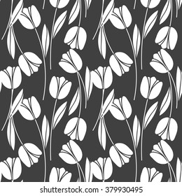Abstract seamless retro pattern with silhouettes of tulips . Floral design . Textile Design . Vintage background with flowers