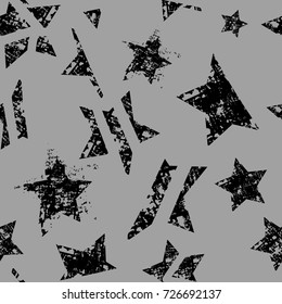 Abstract seamless stars pattern. Grunge urban repeated backdrop for textile, clothes, wrapping paper. Monochrome wallpaper with textured, shabby cracked elements. 