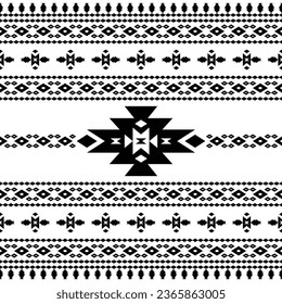 Abstract seamless tribal pattern with Native American motive in black and white. Background in ethnic style design for textile.