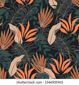 Abstract seamless tropical pattern with bright green and orange leaves and plants on dark background.  Vector design. Jungle print. Floral background.  Seamless exotic pattern with tropical plants.