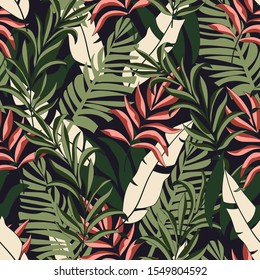 Abstract seamless tropical pattern with bright white and pink plants and leaves on dark green background. Seamless exotic pattern with tropical plants. Tropical botanical.