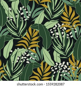 Abstract seamless tropical pattern with bright green and yellow plants and leaves on dark background. 
Beautiful exotic plants.  
Jungle leaf seamless vector floral pattern background.