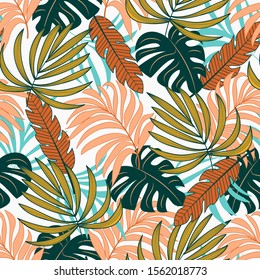 Abstract seamless tropical pattern with bright green and orange plants and leaves on white background. Beautiful exotic plants.  Jungle leaf seamless vector floral pattern background.