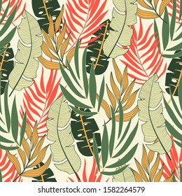 Abstract seamless tropical pattern with bright green and red plants and leaves on a light background. 
Beautiful print with hand drawn exotic plants. Summer colorful hawaiian.