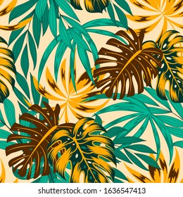 Abstract seamless tropical pattern with bright yellow and brown plants and leaves on a beige background. 
Seamless pattern with colorful leaves and plants. Exotic jungle wallpaper. Hawaiian style.