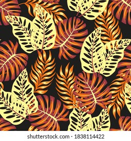 Abstract seamless tropical pattern with bright plants and leaves on a brown background. Beautiful print with hand drawn exotic plants.Trendy summer Hawaii print.