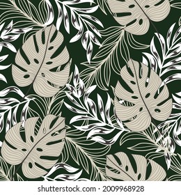 Abstract seamless tropical pattern with bright colorful plants and leaves on a dark green background. Summer colorful hawaiian. Summer colorful hawaiian seamless pattern with tropical plants.