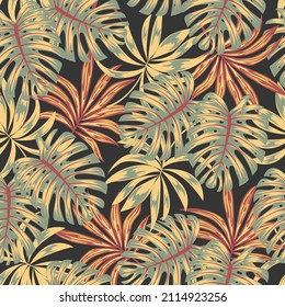 Abstract seamless tropical pattern with bright plants and leaves on a dark green background. Trendy summer Hawaii print. Exotic jungle wallpaper. Tropical botanical. Jungle print.