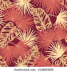 Abstract seamless tropical pattern with bright plants and leaves on a red background. Seamless exotic pattern with tropical plants. Exotic wallpaper. Hawaiian style.