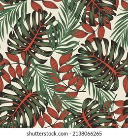 Abstract seamless tropical pattern with bright plants and leaves on a beige background. Trendy summer Hawaii print. Modern abstract design for fabric, paper, interior decor.