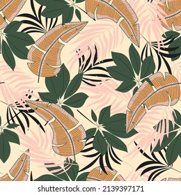 Abstract seamless tropical pattern with bright plants and leaves on a beige background. Hawaiian style. Tropic leaves in bright colors. Beautiful seamless vector floral pattern.