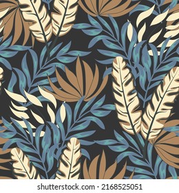 Abstract seamless tropical pattern with bright plants and leaves on a gray background. Modern abstract design for fabric, paper, interior decor. Vector design. Jungle print. Floral background. 