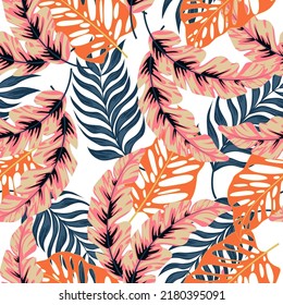 Abstract seamless tropical pattern with bright plants and leaves on a white background. Seamless exotic pattern with tropical plants. Exotic jungle wallpaper.