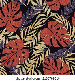 Abstract seamless tropical pattern with bright plants and leaves on a dark background. Seamless exotic pattern with tropical plants. Tropic leaves in bright colors. Exotic jungle wallpaper.