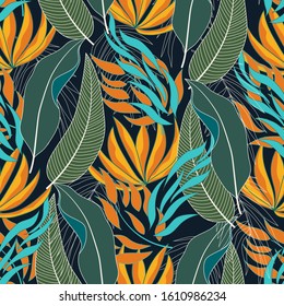 Abstract seamless tropical pattern with colorful green and yellow plants and leaves on a dark background. Jungle leaf seamless vector floral pattern background. Vintage pattern.