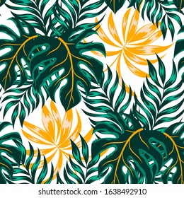 Abstract seamless tropical pattern with colorful green and yellow plants and leaves on a white background. Beautiful seamless vector floral pattern. 
Jungle leaf seamless vector floral.