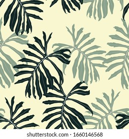 Abstract seamless tropical pattern with colorful leaves on yellow background. Seamless exotic pattern with tropical plants. Exotic wallpaper. Trendy summer Hawaii print.