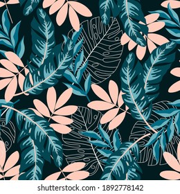 Abstract seamless tropical pattern with leaves and plants on a dark background. Trendy summer Hawaii print. Floral pattern. Printing with in hand drawn style. Jungle leaves.