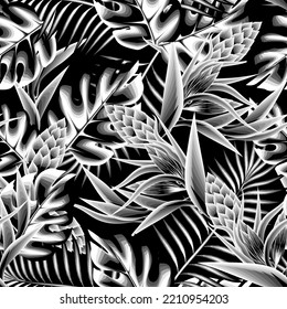 abstract seamless tropical pattern with vintage nature plants leaves and foliage on dark background. Composition with flowers and exotic palm leaves. monochromatic tropical seamless pattern. natural