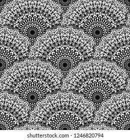 Abstract seamless vector lace pattern. Black and white repeating wallpaper with creative mandalas. Beautiful background with abstract floral scales.