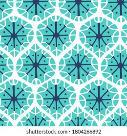 Abstract seamless vector ornament of snowflake shapes in pastel winter colors