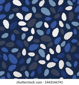 Abstract seamless vector pattern with blue and grey brush strokes/spots on a dark blue background. Terrazzo/mosaic design for textiles, wallpaper, fabric.