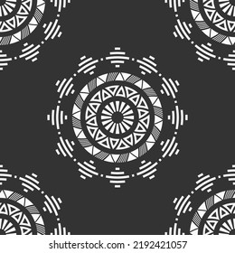 Abstract seamless vector pattern with round geometric shapes, flower shapes. Tribal pattern. Sun symbols. Geometric shapes pattern. White shapes, isolated on black background.
