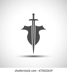 Abstract shield and sword emblem with shadow.