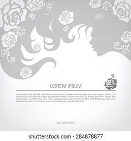 Abstract silhouette of a girl with flowing hair, curls of hair on a gray background.