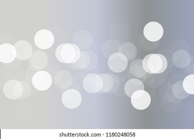 Abstract silver bokeh background with white light at center