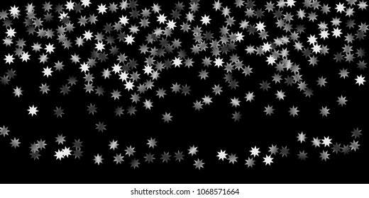 Abstract silver star of confetti. Falling starry background. Random stars shine on a black background. The dark sky with shining stars.  Suitable for your design, cards, invitations, gifts. 